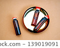 Small brown medicine bottles on a golden tray 139019091