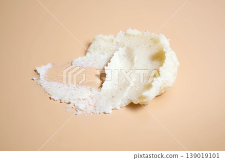 Skincare exfoliant texture cosmetic innovation swirled on peach background Skincare exfoliant texture cosmetic innovation swirled on peach background 139019101