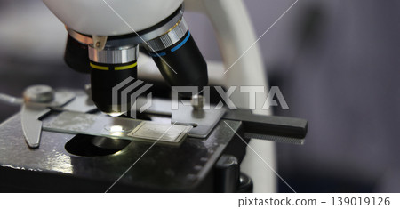 Microscope. Advanced microscopes and digital imaging systems analyzing samples in a modern laboratory. Ideal for medical research microbiology diagnostics biotechnology and science innovation concept Microscope. Advanced microscopes and digital imaging systems analyzing samples in a modern laboratory. Ideal for medical research microbiology diagnostics biotechnology and science innovation concept 139019126