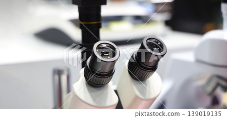 Microscope. Advanced microscopes and digital imaging systems analyzing samples in a modern laboratory. Ideal for medical research microbiology diagnostics biotechnology and science innovation concept Microscope. Advanced microscopes and digital imaging systems analyzing samples in a modern laboratory. Ideal for medical research microbiology diagnostics biotechnology and science innovation concept 139019135