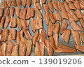 The surface or background of sun-dried striped snakehead fish has a salty taste, which is a type of food preservation used in Asia. 139019206