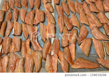 The surface or background of sun-dried striped snakehead fish has a salty taste, which is a type of food preservation used in Asia. 139019206