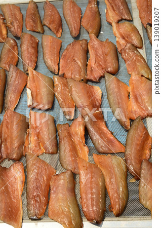 The surface or background of sun-dried striped snakehead fish has a salty taste, which is a type of food preservation used in Asia. 139019207