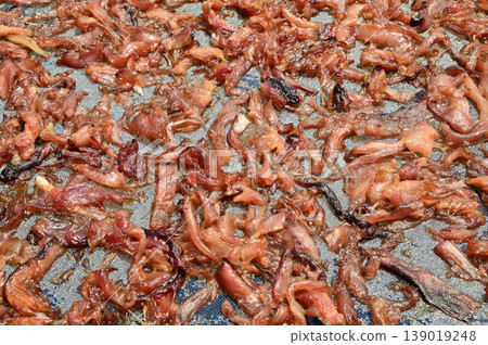 The surface or background of sun-dried striped snakehead fish has a salty taste, which is a type of food preservation used in Asia. 139019248