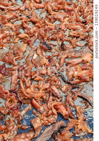 The surface or background of sun-dried striped snakehead fish has a salty taste, which is a type of food preservation used in Asia. 139019249