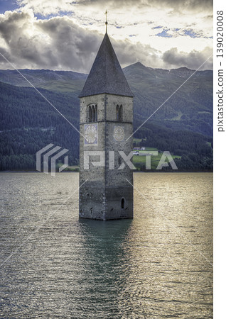 The iconic submerged Church Tower of Graun, Lake Reschensee, Italy The iconic submerged Church Tower of Graun, Lake Reschensee, Italy 139020008