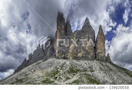 Dramatic sky over Tre Cime di Lavaredo mountains, Dolomites, Italy Dramatic sky over Tre Cime di Lavaredo mountains, Dolomites, Italy 139020038