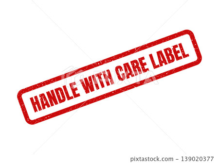 Red textured rectangular rubber stamp with HANDLE WITH CARE LABEL indicating a specific handling instruction 139020377
