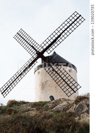 Front view of picturesque white windmill. Consuegra, Toledo, Spain Front view of picturesque white windmill. Consuegra, Toledo, Spain 139020785