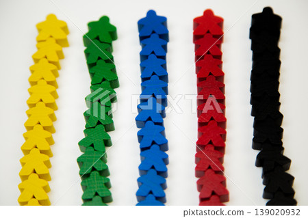 On a white background, men of different colors lie in a line, with a large man at the base, divided into teams. The concept of team competitions, community groups, people. High quality photo On a white background, men of different colors lie in a line, with a large man at the base, divided into teams. The concept of team competitions, community groups, people. High quality photo 139020932