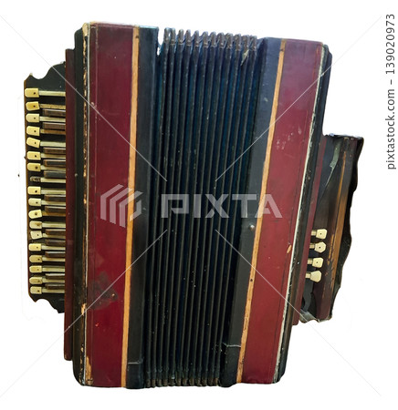 An old retro accordion sits alone against a white background. The instrument has visible keys and a worn finish. It shows signs of age and has a classic design that highlights its history. An old retro accordion sits alone against a white background. The instrument has visible keys and a worn finish. It shows signs of age and has a classic design that highlights its history. 139020973
