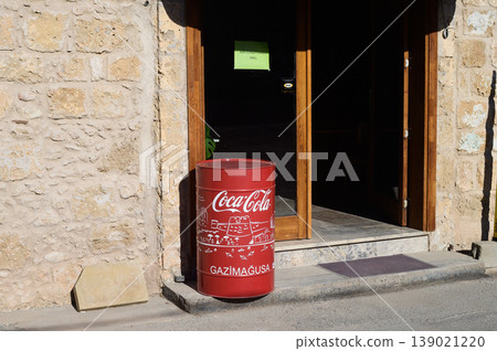A vintage Coca-Cola barrel stands proudly at the entrance in Gazimagusa A vintage Coca-Cola barrel stands proudly at the entrance in Gazimagusa 139021220