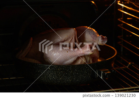 A succulent turkey roasting in the oven, filling the kitchen with delicious arom A succulent turkey roasting in the oven, filling the kitchen with delicious arom 139021230