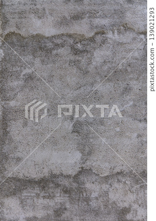 A textured concrete wall showcasing an intricate blend of gray hues and subtle imperfections in natural light A textured concrete wall showcasing an intricate blend of gray hues and subtle imperfections in natural light 139021293