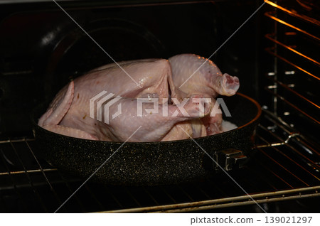 Juicy turkey roasting in an oven, ready to be served for a festive family Juicy turkey roasting in an oven, ready to be served for a festive family 139021297