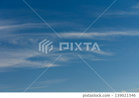 Whispers of the sky dance above a serene landscape at twilight, inviting 139021346