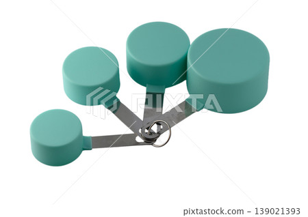 Complete set of eco green kitchen measuring cups in different sizes, flat lay on white Complete set of eco green kitchen measuring cups in different sizes, flat lay on white 139021393