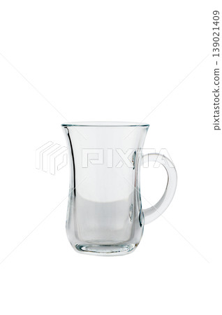 Glass tea mug with handle, isolated on white background. 139021409