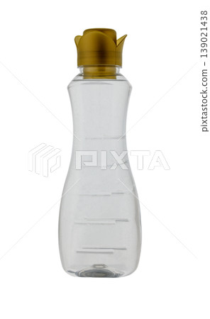 Transparent plastic bottle for household chemicals with gold flower bud cap isolated on white background Transparent plastic bottle for household chemicals with gold flower bud cap isolated on white background 139021438