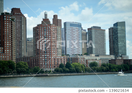 Metropolitan Skyline Highlights Busy Port Activity With Sailboats And Modern Structures. New York Metropolitan Skyline Highlights Busy Port Activity With Sailboats And Modern Structures. New York 139021634