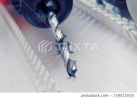 Magnetic effect of metal shavings after drilling close up Magnetic effect of metal shavings after drilling close up 139021658