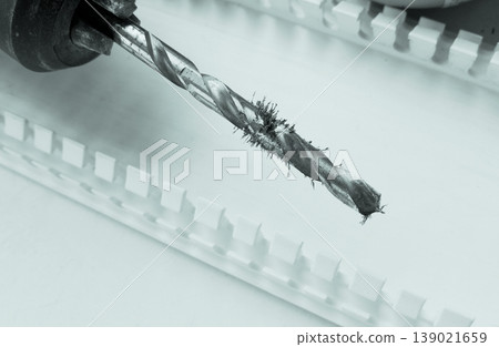 Magnetized shavings on the metal drill bit macro shot  139021659