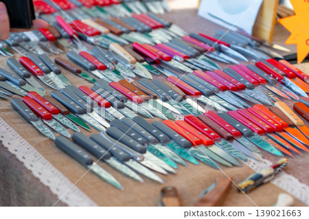 Small handmade pochet knives displayed for sale at the market Small handmade pochet knives displayed for sale at the market 139021663