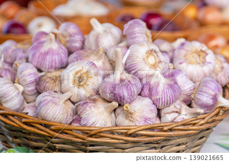 Garlic in a basket for sale at a market stall 139021665