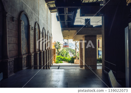 The interior of the ropeway station. A magnificent building with arched murals and rows of stone columns. The interior of the ropeway station. A magnificent building with arched murals and rows of stone columns. 139022073