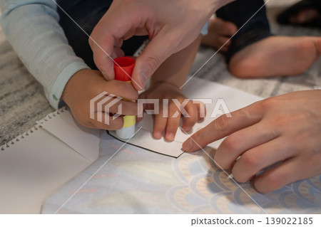 Parents and children making carp streamers as a craft activity. Parents and children making carp streamers as a craft activity. 139022185
