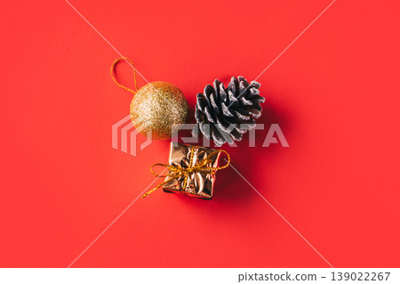 Beautiful Christmas ornaments on a red background. Minimal concept. Beautiful Christmas ornaments on a red background. Minimal concept. 139022267