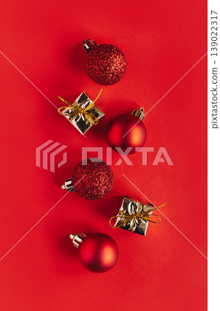 Beautiful Christmas ornaments with decorations on a bright red background. Beautiful Christmas ornaments with decorations on a bright red background. 139022317