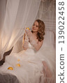 Refined Studio Scene Showcasing Tranquil Bride Embraced By Sparkling Beads And Delicate Drapery 139022458