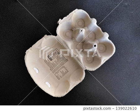 Empty Egg Carton on Dark Background Empty Egg Carton on Dark Background 139022610
