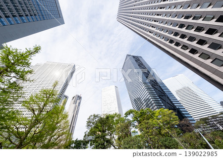A view of an office district looking up at fresh greenery and skyscrapers 139022985