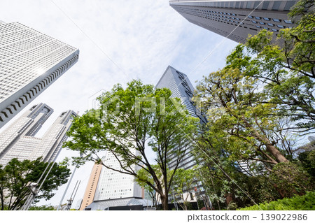 A view of an office district looking up at fresh greenery and skyscrapers 139022986