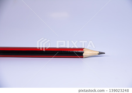 Close up of wooden pencil tip isolated on white background with large copy space. Minimal stationery concept for education, writing, drawing, school supplies and academic workspace. Close up of wooden pencil tip isolated on white background with large copy space. Minimal stationery concept for education, writing, drawing, school supplies and academic workspace. 139023248
