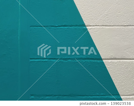 Teal geometric paint on white brick wall minimal modern background 139023538