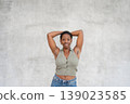 Young woman showing underarm hair with smile body 139023585
