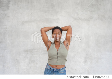 Young woman showing underarm hair with smile body Young woman showing underarm hair with smile body 139023585