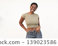 Portrait of smiling woman with short Afro hair 139023586