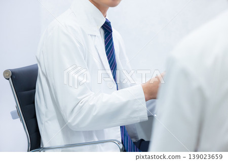 doctor in examination room doctor in examination room 139023659