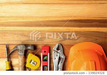 Construction tools on wood table background. Top view with copy space. Construction tools on wood table background. Top view with copy space. 139024328