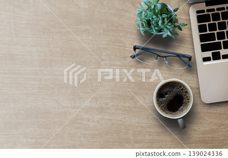 Flat lay top view photo of laptop keyboard with mug of beverage 139024336