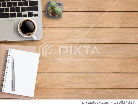 Flat lay top view photo of laptop keyboard with mug of beverage Flat lay top view photo of laptop keyboard with mug of beverage 139024337
