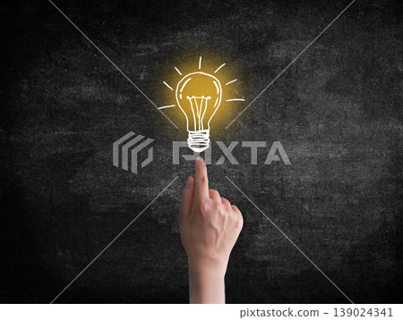 Hand point to light bulb. Creativity concept for good ideas Hand point to light bulb. Creativity concept for good ideas 139024341
