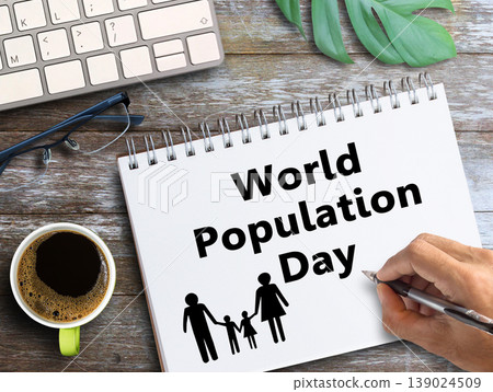 Top view with World Population Day text in notebook 139024509