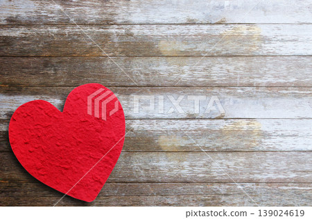 Red paper heart on wooden table background. Red paper heart on wooden table background. 139024619