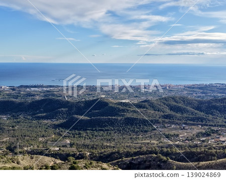 Hills And Buildings Reflect Calm Water, Seaside Landscape With Clouds And Gentle Reflections 139024869