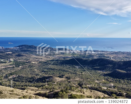 Serene Hillside Scene With Winding Roads, Coastal Landscape Featuring Blue Sea And Tranquil Atmosphere Serene Hillside Scene With Winding Roads, Coastal Landscape Featuring Blue Sea And Tranquil Atmosphere 139024872